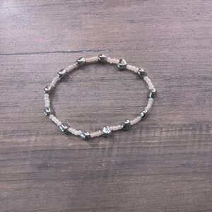Handmade stretchy silver heart beaded bracelet.